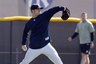 New York Yankees reliever Dave Robertson throws long toss during a workout at the Yankees minor league facility in Tampa, Fla.  Pitchers and catchers report to the Yankees main spring training facility Wednesday and have their first official workout  on Thursday. (AP Photo/Kathy Willens)