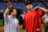 ST. PETERSBURG:  Executive Vice President Andrew Friedman of the Tampa Bay Rays talks with outfielder Josh Hamilton #32 of the Texas Rangers during batting practice before Game 5 of the ALDS at Tropicana Field in St. Petersburg, Florida.  (Photo by J. Meric/Getty Images)