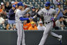 Baltimore, MD, USA; Texas Rangers left fielder Josh Hamilton (32) is congratulated by third base coach Dave Anderson (16) after hitting a two-run home run in the first inning against the Baltimore Orioles at Oriole Park at Camden Yards. Mandatory Credit: Joy R. Absalon-US PRESSWIRE